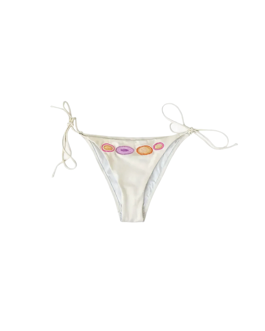 White bikini bottom with colourful embroidered dots on a white background